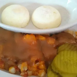 Perfectly cooked taters, smothered in cheese and brown gravy and a side of pickles. Paired with poached Eggs. Delicious!