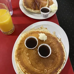 Adult pancake, and kids pancake with bacon on the top.