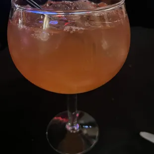 a drink in a glass on a table