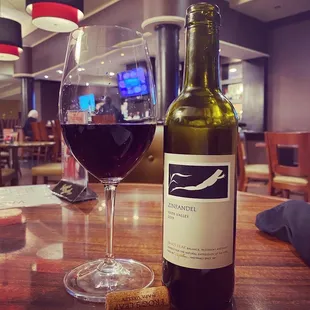 a glass of wine and a bottle of wine