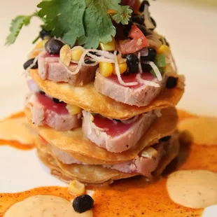 Ahi tuna tostada- Tortillas, black bean jicama relish, chipotle creme &amp; chile lime vinaigrette...