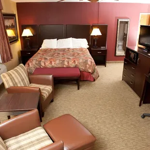 king size bed, desk, and chair