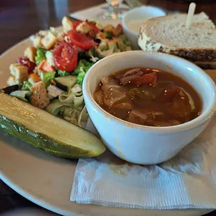 Half sandwich (pastrami and corned beef, swiss cheese, with cole slaw).  Russian Cabbage soup. Chopped salad.  Tasty, right amount of food,