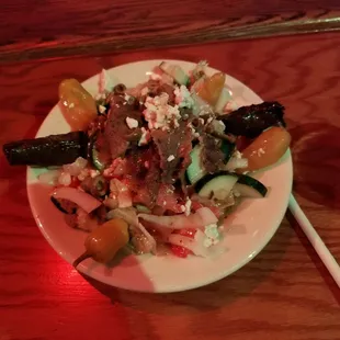 The Greek Salad with Gyro meat and grape leaf's.