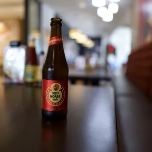 a bottle of beer on a table