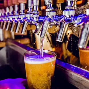 a beer being poured into a glass