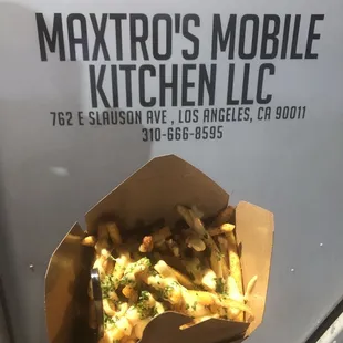 Fries with a delicious seasoning, creamy sauce drizzled on top and fresh herbs