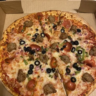 Medium supreme pizza - DELISH but getting skimpy on toppings.