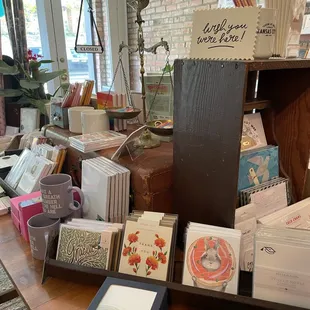 Gifts, cards, notebooks, stickers, pens, mugs, etc