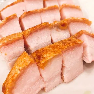 a plate of sliced pork