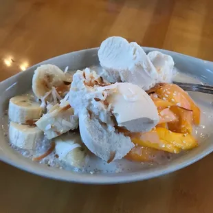 Dessert - GET THIS! Mango over sticky rice in vanilla cream, sprinkled with coconut bits! I love the addition of banana too.