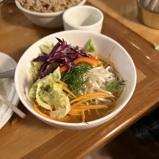 a bowl of noodles and vegetables