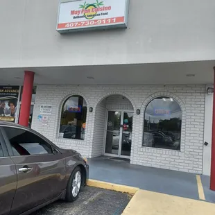 a car parked in front of the restaurant