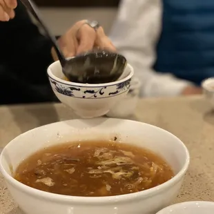 a bowl of soup with a spoon in it