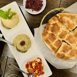 Maya spreads trio with hummus, baba ganoush, and htipiti