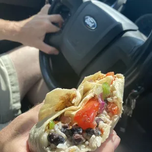 chicken burrito with Black beans, vegetables, sour cream and guacamole
