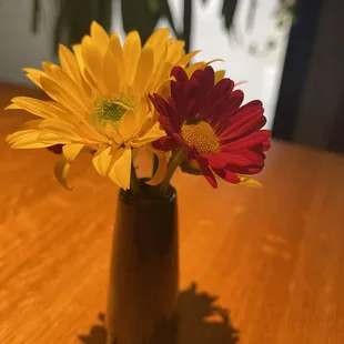 Real flowers!!  Simple but cute centerpieces on each table