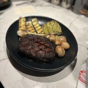 Seared Ribeye with a coffee rub, grilled zucchini and cactus