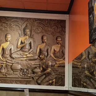 a mural of buddhas