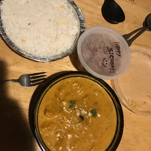 Rice, chicken korma, and a complimentary birthday dessert (I think gulab jamun)
