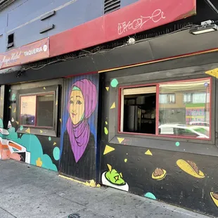 a colorful mural on the side of a building