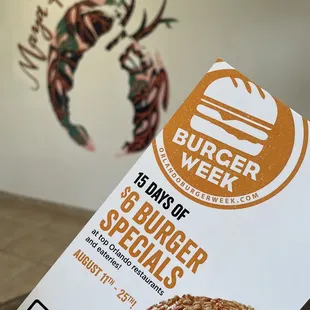 a hand holding a burger