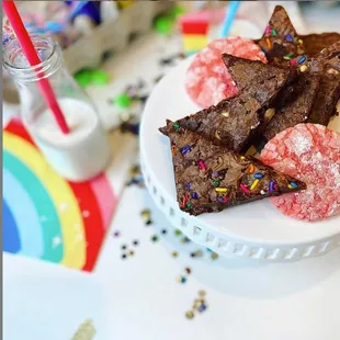 a plate of brownies with sprinkles