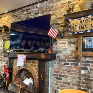 a brick wall and fireplace