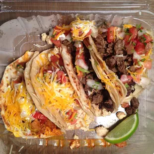 The tacos.  From left to right, Adobada (pork), chicken, and two beef tacos.  They look a lot better than they tasted.