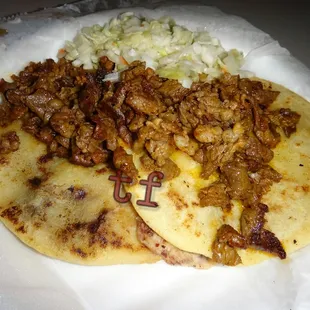 Pupusas topped with beef and pork