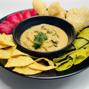Sikil P&apos;ak  (SEE keel pock) Mayan salsa pumpkin seed dip , chicharron, stone-ground tortilla chips, radishes.