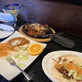 Three meat fajitas and a nearly empty mandarin margarita