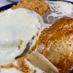 Tamal, chile relleno, rice and beans combo.