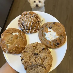 Oreo (top), white chocolate macadamia (left), s&apos;more (right), and wheat free drunken grandma (bottom).