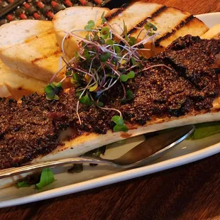 Roasted Bone Marrow - bacon bourbon fig jam, Pupukea greens, ho farms cherry heirloom tomatoes, toast points