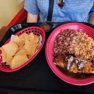 Enchilada plate with pinto beans