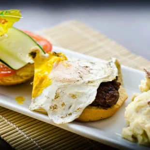 Our Hamburger, complete with Lettuce, Mayo, Tomato, Cucumber, and a fried egg!