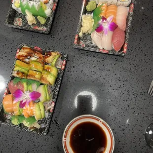 a variety of sushi dishes on a table