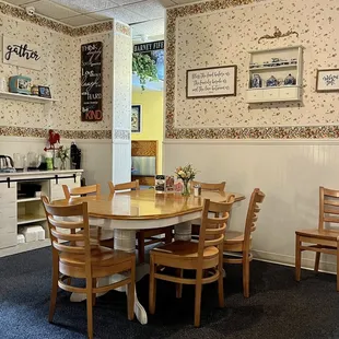 a dining room with a table and chairs