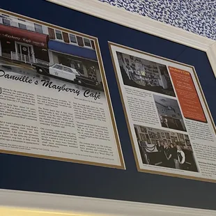 Newspaper review on wall.