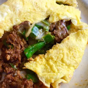 (Almost) zero carb breakfast.  Mexican omelette overflowing with chorizo...it comes with toast and taters if you want 'em.