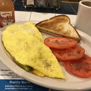 Three cheese omelet with fresh avocado.  Skip the hash browns and gimme one slice of toast for dessert.