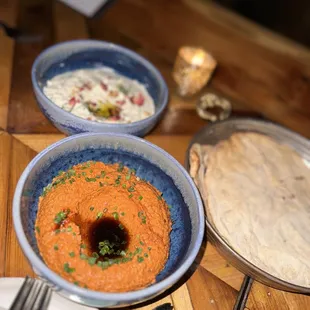 three bowls of food on a table