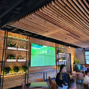 people sitting at tables in a restaurant