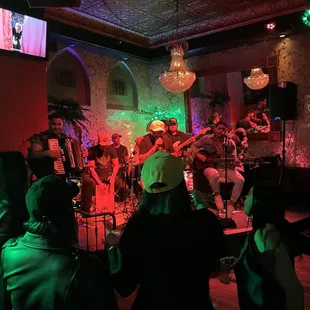 a band performing in a dimly lit room