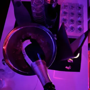 a wine bottle in an ice bucket