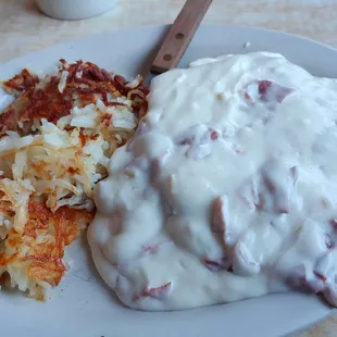 Creamed chipped beef over white toast with home fries...