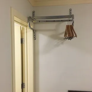 Efficient use of space.  There is no room for a closet, yet you are able to hang your clothes outside the bathroom.