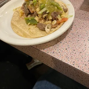 Taco made from carne asada meal.