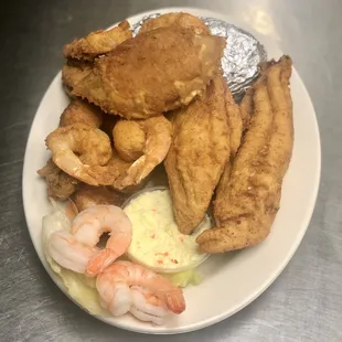 a plate of fried fish and shrimp